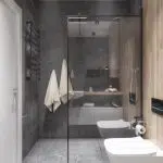 Nowoczesna łazienka z ciemnymi płytkami i jasnymi dekoracjami