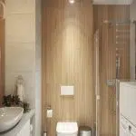 Widok na kafle imitujące drewno i sedes w łazience
