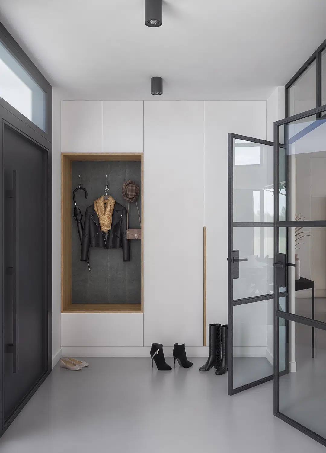 Wejście do mieszkania z dużą szafą w zabudowie i przeszklonymi drzwiami w czarnym kolorze