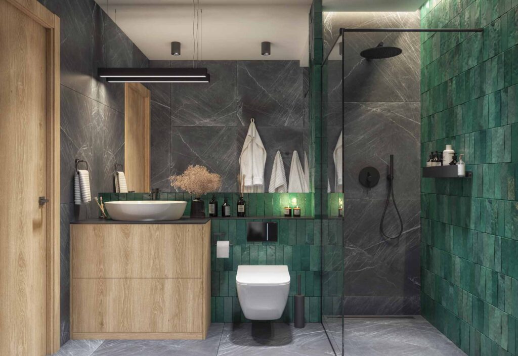 Stylowa łazienka z żywymi, zielonymi płytkami na ścianie prysznicowej, ciemnym marmurem, drewnianymi meblami i nowoczesnym wyposażeniem.